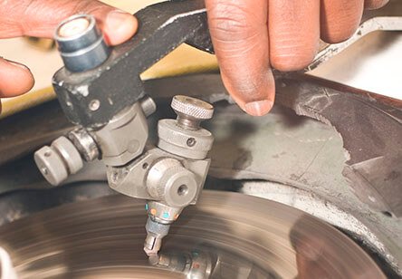 A diamond made from hair in the cutting process, note the tang holder and the spinning scaife